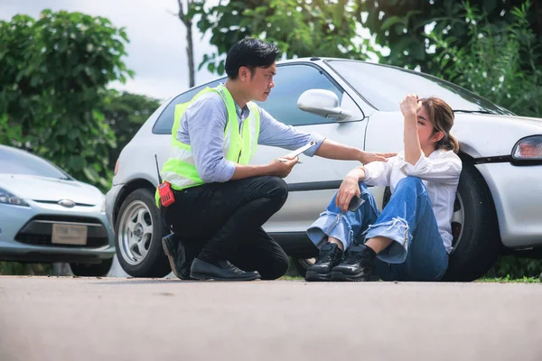 Accident, crash or collision of auto car, bicycle at outdoor. Include people i.e. insurance officer man and young girl or bicycle rider to injury on road. Concept for vehicle crash, insurance claim.