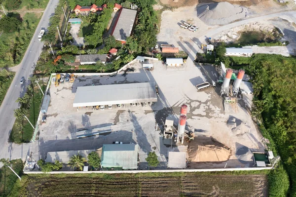 Concrete plant or batching plant in top view. Building and equipment for production ready mix concrete by mix aggregate material i.e. cement, water, sand, rock or gravel for construction work.