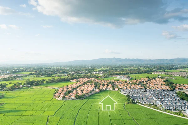 stock image Land or landscape of green field in aerial view. Include agriculture farm, icon of home, house or residential building. Real estate or property for dream concept to build, construction, sale and buy.