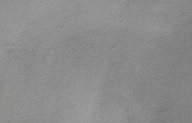 Beton duvar sıvası, iç bina için çimento karışımı, kum veya inşaat malzemesi desenlerinden oluşur. Düz pürüzsüz, gri renkli. Boş, boş ve arka planda kimse yok.