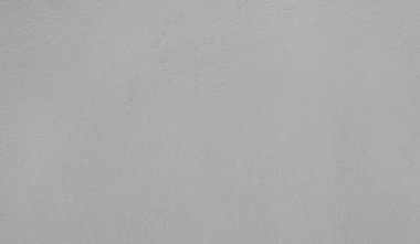 Beton duvar sıvası, iç bina için çimento karışımı, kum veya inşaat malzemesi desenlerinden oluşur. Düz pürüzsüz, gri renkli. Boş, boş ve arka planda kimse yok.