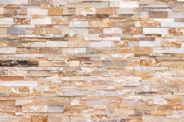 Doğal taş dokusu arka planı. Bej kahverengi renk. Kare dikdörtgen şekli yatay sıra çizgisi şeklinde. Mimari dekorasyon için malzeme, duvar kaplama paneli ön cephe, otel, havuz villası, tatil köyü.