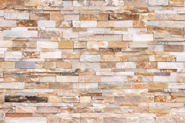 Doğal taş dokusu arka planı. Bej kahverengi renk. Kare dikdörtgen şekli yatay sıra çizgisi şeklinde. Mimari dekorasyon için malzeme, duvar kaplama paneli ön cephe, otel, havuz villası, tatil köyü.