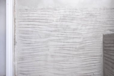 Beton duvar sıva ve kabataslak yüzey ya da inşaat halindeki tuvalet ve banyodaki fayansları onarmak için tırnak dokusu deseni.