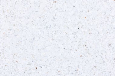 Terrazzo dikişsiz doku arka planı. Yeni temiz, parlak ve parlak bir yüzey. Havan harcı ile karıştırılmış küçük çakıllar. Döşeme, duvar ya da dış dekorasyon için pürüzsüz cilalanmış.