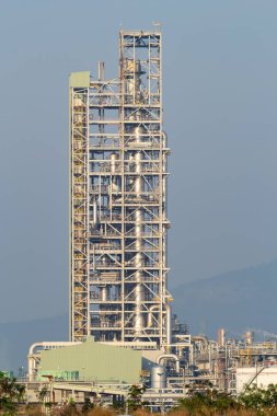 Distillation tank tower in oil gas refinery plant in Map Ta Phut, Rayong. May called petroleum or petrochemical plant. High building of industrial factory to production gasoline, fuel power energy.