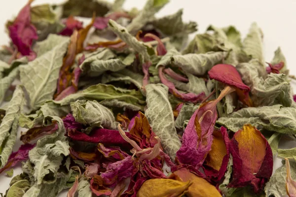 Dry tea mint, rose leaves background. Detox and immunity tea. Medical herb, healing, therapeutic and wellbeing plant, healthy food, horizontal