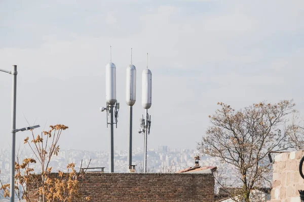 telecommunications and cell phone base station. wireless signal transmission stations. urban building.