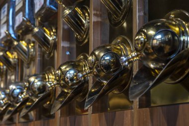 Different types of coffee in special dosing devices. Coffee for sale. Coffee beans store. Selective Focus Middle one.