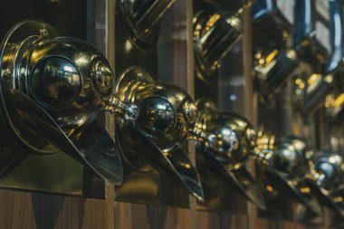 Different types of coffee in special dosing devices. Coffee for sale. Coffee beans store. Selective Focus Middle one.