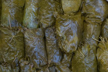 Pickled grape leaves close-up. Grape leaves for preparation of traditional oriental dishes and snacks on counter of Grand bazaar Istanbul. 