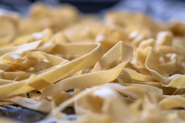 Homemade fresh pasta close-up. Italian traditional Tagliatelle fresh.pasta.