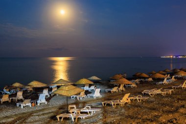 Night view of the sea beach resort tourist town. Romantic travel background