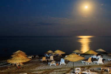 Night view of the sea beach resort tourist town. Romantic travel background