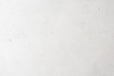 Sert desenli beton yüzey beyaza boyanmış. Grunge arkaplanı