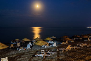 Night view of the sea beach resort tourist town. Romantic travel background