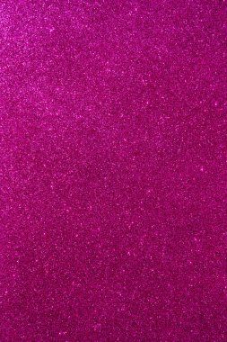 Işıltılı bir arka plan. Arkaplanda simler var. Parlak desenli yüzey. Dikey görüntü. Koyu pembe. Yumuşak ışık