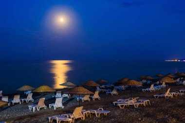 Night view of the sea beach resort tourist town. Romantic travel background