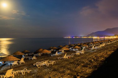 Night view of the sea beach resort tourist town. Romantic travel background