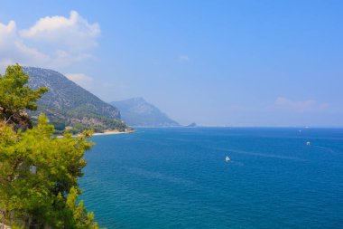 Very beautiful rocky Turkish Mediterranean coast in Beldibi district of Kemer, Antalya province in Turkey. Background or landscape