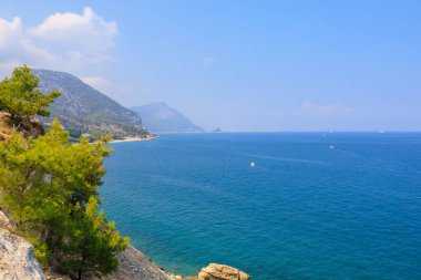 Very beautiful rocky Turkish Mediterranean coast in Beldibi district of Kemer, Antalya province in Turkey. Background or landscape