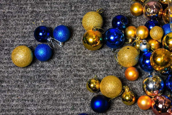 Christmas balls on the floor. Preparation for the holidays. Background with selective focus and copy space