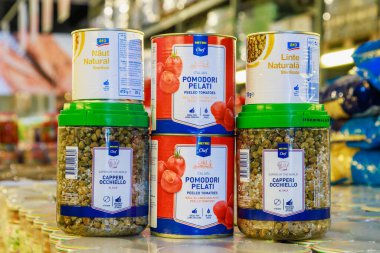 Canned peas and tomatoes on the store shelf. Illustrative editorial. May 12, 2022 Balti Moldova