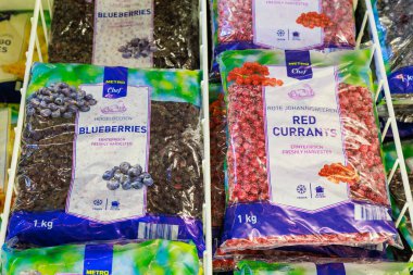 Frozen blueberries and red currants on a store shelf. Illustrative editorial. May 12, 2022 Balti Moldova