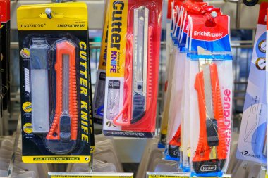 Stationery knives on the store shelf. Illustrative editorial. February 2, 2022 Balti Moldova