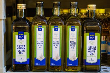 Olive oil on the store shelf. Illustrative editorial. May 12, 2022 Balti Moldova