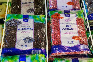 Frozen blueberries and red currants on a store shelf. Illustrative editorial. May 12, 2022 Balti Moldova