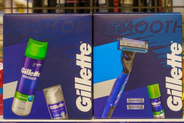 Shaving gel and spare Gillette blades on a store shelf. Illustrative editorial. February 24, 2022 Balti Moldova