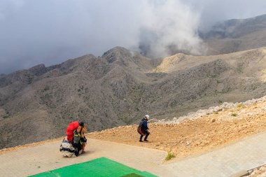 Thrill-seekers on the top of Mount Tahtali. Illustrative editorial. August 9, 2022 mountain near Kemer, Antalya province, Turkey
