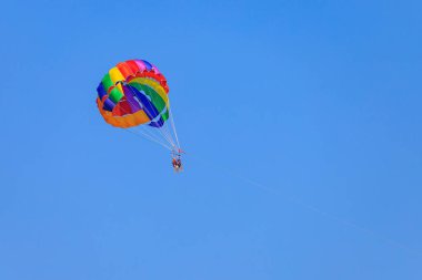 Parachute on the background of the sky. Popular attraction for tourists. August 7, 2022 Beldibi, Antalya province, Kemer region, Turkey.