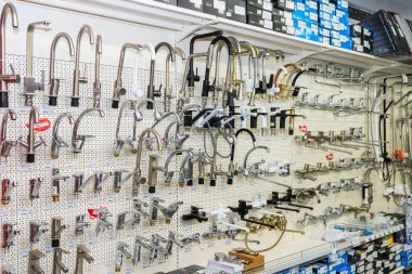 Faucets for kitchen and bathroom, selective focus. Goods in a building materials store. June 24, 2022 Beltsy Moldova.