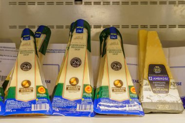 Italian parmesan cheese. Goods on the store shelf, supermarket showcase. April 14, 2022 Beltsy Moldova.