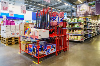 Mops and brooms on the store shelf. April 7, 2022 Beltsy Moldova.