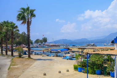 A small port in the Turkish bay with pleasure yachts on the rocky coast of the Mediterranean Sea. August 10, 2022 Demre, Antalya province, Turkey.