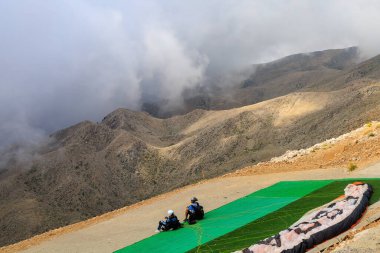 Thrill-seekers on the top of Mount Tahtali. Illustrative editorial. August 9, 2022 mountain near Kemer, Antalya province, Turkey