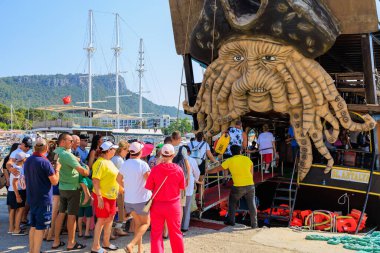 Pleasure yacht for tourists in the seaport. Background with copy space. August 9, 2022 Kemer, Antalya province, Turkey.