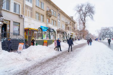 Snow-covered city with snowdrifts in the winter cold season. December 28, 2021 Beltsy Moldova.