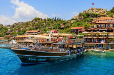 August 10, 2022 Demre, Antalya province, Turkey. Yachts near the Turkish rocky shore. Background with copy space for text