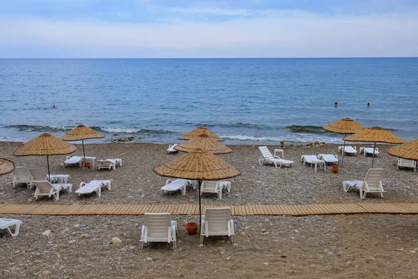 August 11, 2022 Beldibi, Kemer district, Antalya Province, Turkey. City public beach. Background with copy space for text