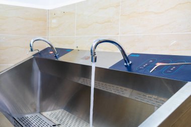 Faucet for bathing newborns. Selective focus. Medical equipment in the maternity ward of the hospital. October 12, 2022 Beltsy Moldova