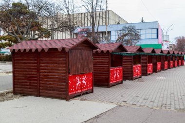 Installation of a Christmas town with fair stalls. December 16, 2021 Balti Moldova.