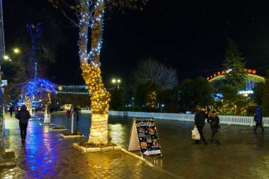 The lights of the night city, decorated with garlands for the Christmas and New Year holidays. December 20, 2021 Balti Moldova.