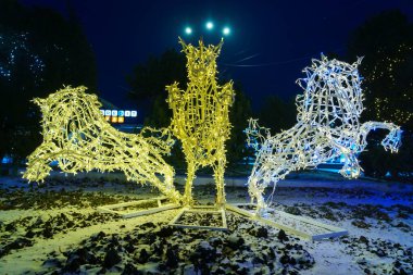 The lights of the night city, decorated with garlands for the Christmas and New Year holidays. December 24, 2021 Balti Moldova.