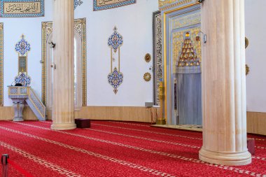 Interior in the mosque HUZUR. City landmark open to tourists. Classic Islamic background. August 9, 2022 Kemer, Antalya province, Turkey.