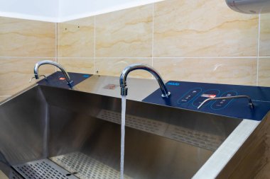 Faucet for bathing newborns. Selective focus. Medical equipment in the maternity ward of the hospital. October 12, 2022 Beltsy Moldova