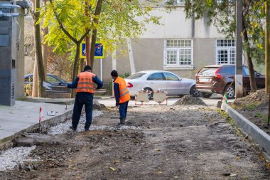 Road workers. Repair of intra-yard or intra-quarter roads, background. November 4, 2022 Beltsy Moldova